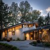 Modern home with Exterior, Metal Roof Material, House Building Type, Shed RoofLine, and Stucco Siding Material. Evening at Gregory Creek Photo of Gregory Creek Residence