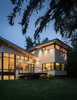 Modern home with Exterior, Metal Roof Material, Shed RoofLine, Metal Siding Material, Stucco Siding Material, Flat RoofLine, and House Building Type. Evening at Gregory Creek Photo 3 of Gregory Creek Residence