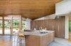 Modern home with Kitchen, Refrigerator, Wall Oven, Cooktops, Engineered Quartz Counter, Wood Cabinet, Ceiling Lighting, Medium Hardwood Floor, Dishwasher, Undermount Sink, and Microwave. Gregory Creek Residence - Kitchen Photo 7 of Gregory Creek Residence