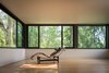 Modern home with Living Room, Chair, Light Hardwood Floor, Recliner, and Ceiling Lighting. Gregory Creek Residence - All Seasons Room Photo 9 of Gregory Creek Residence