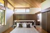 Modern home with Bedroom, Ceiling Lighting, and Medium Hardwood Floor. Gregory Creek Residence - Bedroom Photo 12 of Gregory Creek Residence