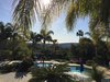 Modern home with Outdoor, Front Yard, Trees, Shrubs, Grass, Hardscapes, Large Pools, Tubs, Shower, Large Patio, Porch, Deck, Horizontal Fences, Wall, and Landscape Lighting. View to the Pacific Ocean Photo 7 of Color Crazy