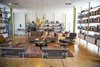 Modern home with Living Room, Ceiling Lighting, Chair, Pendant Lighting, Coffee Tables, Bookcase, Recliner, Ottomans, Rug Floor, Sofa, and Cork Floor. Living Room Photo 5 of Hiss Studio