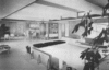 Modern home with Living Room, Chair, Sofa, Terrazzo Floor, and Bookcase. 1955 photo of the David Cohen House on Siesta Key, Florida
David Cohen, the original owner, was a violinist and co-founder of the then-Florida West Coast Symphony. The architect Paul Rudolph included a conversation pit in the living room where musicians would gather to play chamber music. Photo of David Cohen House