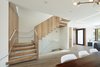 Modern home with Staircase, Wood Tread, Wood Railing, and Glass Railing. Dining area, looking toward central stair and entry alcove. Photo 9 of Noe Valley House