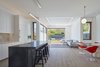 Modern home with Pendant Lighting, Medium Hardwood Floor, Recessed Lighting, and Ceiling Lighting. Kitchen and Breakfast area, looking toward Family area and back yard beyond. Photo 13 of Noe Valley House