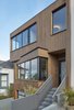 Modern home with Exterior, Flat RoofLine, Wood Siding Material, and House Building Type. View of front entrance from sdiewalk. Photo 3 of Noe Valley House