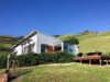 Main barn and side deck with fire pit Photo 18 of Barking Dog Ranch modern home