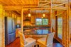 Modern home with Kitchen, Quartzite Counter, Refrigerator, Wood Cabinet, and Range Hood. Elegant quartz countertops Photo 8 of Hawaii Bamboo Home