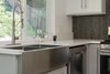 Modern home with Kitchen, Engineered Quartz Counter, Wood Cabinet, White Cabinet, Dishwasher, Range, and Glass Tile Backsplashe. Kraus 36" Apron sink Photo 12 of Briarwood Place