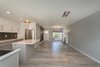 Modern home with Dining Room and Ceiling Lighting. Open concept view from the end of the kitchen through the doorway Photo 13 of Briarwood Place