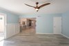 Modern home with Living Room and Ceiling Lighting. The family room featuring a Minka Aire ceiling fan Photo 17 of Briarwood Place