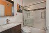 Modern home with Bath Room, Drop In Sink, Porcelain Tile Floor, Soaking Tub, Granite Counter, Enclosed Shower, Recessed Lighting, Wall Lighting, Glass Tile Wall, Subway Tile Wall, and One Piece Toilet. Hallway bathroom Photo 19 of Briarwood Place