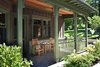 The 7,000-square-foot two-story Grove Lodge incorporates the use of native stone and natural finishes to help it blend into the scenic landscape of the Mohonk Mountain House property.
Interior spaces include hardwood floors and the use of exposed wood throughout. The guest rooms have their own separate drive-up entrances and feature either a stone patio (lower level) or balcony area. All areas are appointed with our rustic rocking chairs for outdoor seating.
Eco-friendly features include sustainable building materials, LED lighting, and a geo- thermal heating and cooling system. 250-tons of Shawangunk conglomerate excavated from the site have been recycled into the retaining walls and the stone fireplace. Photo 3 of Grove Lodge at Mohonk Mountain House modern home