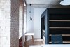 Modern home with Living Room, Coffee Tables, Pendant Lighting, Ceiling Lighting, and Chair. Black | white | exposed brick wall Photo of Startup office in Prezlauer Berg