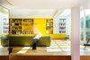 Modern home with Storage, Sofa, Chair, Shelves, Living Room, Table Lighting, Lamps, and Light Hardwood Floor. London studio AMA uses bold Bauhaus colors to invigorate Chevron House, a five-bedroom home in a brick Edwardian building in West London. Photo 5 of Chevron House
