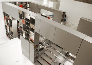 For this family loft in Florence, Italy, architecture practice Fabbricanove created an almost sci-fi-like, 26-foot-tall storage structure with drawers and shelves that organize everything associated with the various aspects of living in the loft.