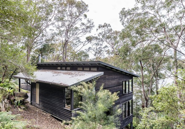 North of Sydney on Dangar Island is a modern Australian vacation rental that's positioned to take full advantage of views of the Hawkesbury River and gorgeous native Angophora trees.