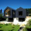 Modern home with Exterior, Gable RoofLine, Metal Siding Material, and House Building Type. Set in a nature park and beech forest in the small Bavarian town of Betzenstein, Germany, is a modern bio-passive vacation house with plenty of quirky details hidden within. Photo 2 of Refugium Betzenstein
