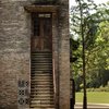 Modern home with Staircase, Metal Tread, and Metal Railing. Much of the sugar mill’s original brickwork and concrete structures were retained and restored. Photo 5 of Alila Yangshuo