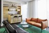 Modern home with Living Room, Sofa, Stools, Bar, End Tables, Shelves, Ceiling Lighting, and Rug Floor. The third hotel from the Gekko Group’s Roomers brand (the other two Roomers are in Frankfurt and Baden-Baden), Roomers Munich, which opened in September 2017, has 281 guest rooms in 12 different configurations, which range from 269 square feet to 1,238 square feet. Photo 2 of Roomers Munich