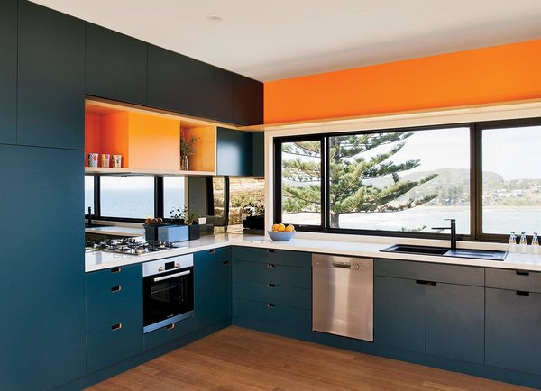 For their ArchiBlox prefab, modular house, the owners chose blue and orange joinery that was inspired by the sea and sand around their coastal home.