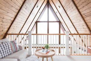 Light streams through the full-glass frontage to brighten the lofted lounge area.