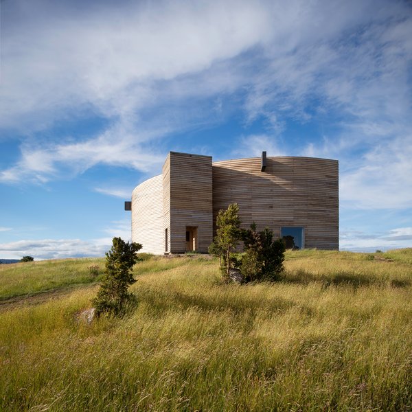 
This by Chilean practice Pezo von Ellrichshausen Arquitectos is built with local timber, with 45 rigid frames set in a fan-shaped configuration.