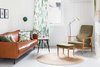 Modern home with Living Room, Storage, Sofa, Lamps, Chair, End Tables, Floor Lighting, Ottomans, and Rug Floor. Midcentury furniture, and thoughtful accents make this holiday rental a truly delightful way to enjoy Norway's Vestfold County. Photo 3 of Hellum House