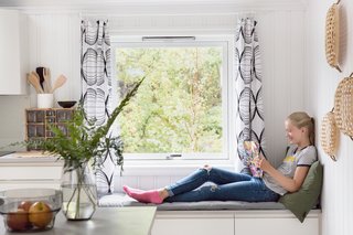 A reading bench next to the kitchen counter.