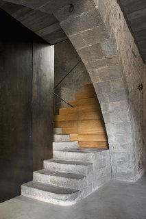 A peek at the entranceway with stairs that lead to the apartment.