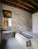 Modern home with Concrete Floor. A clean-lined bathroom of stone and concrete. Photo 11 of Girona Townhouse