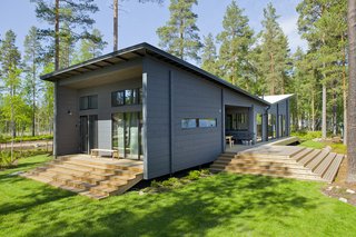 Winner of the 2011 Log House of the Year Award, the 1,206-square-meter Lokki, which was designed by as architect Kari Lappalainen and furnished by interior designer Hanni Koroma, has an inverted pitch roof that’s inspired by seagull wings.