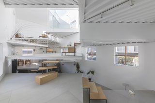 A space of 2.3 feet between the platforms allow the floor surfaces to double up as shelves, tables, or seating.