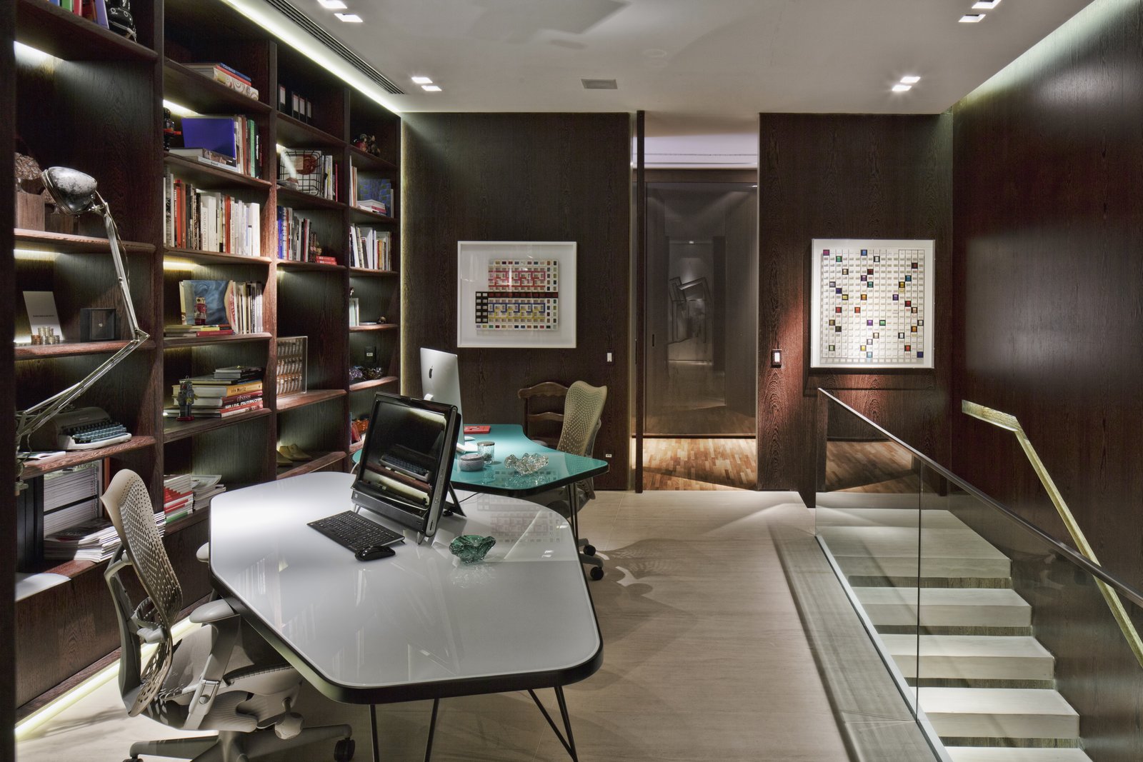 On the upper level is the master and guest bedrooms, an office, and fitness room.