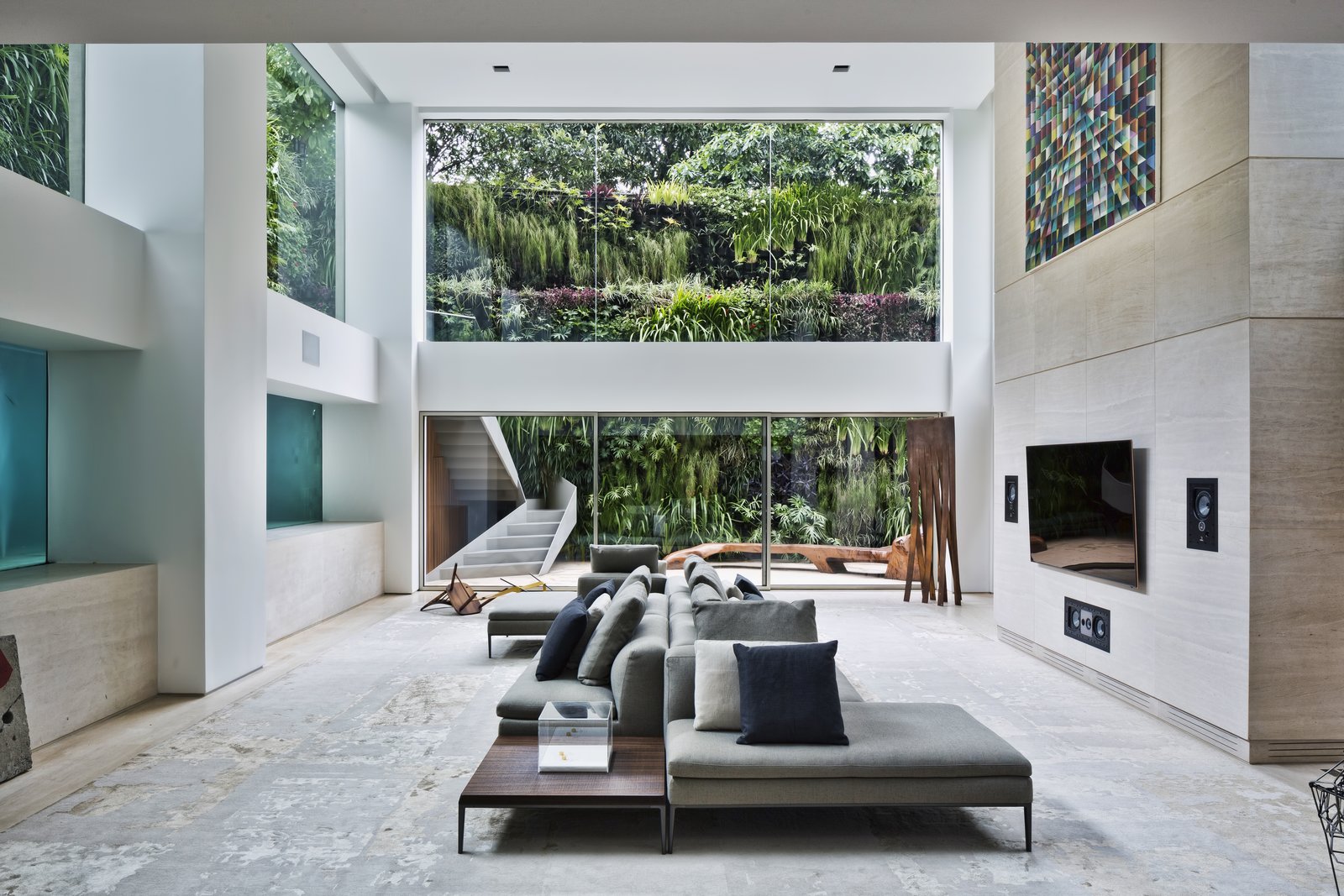 With expansive glass walls, the surrounding outdoor setting appears a stunning work of art.
