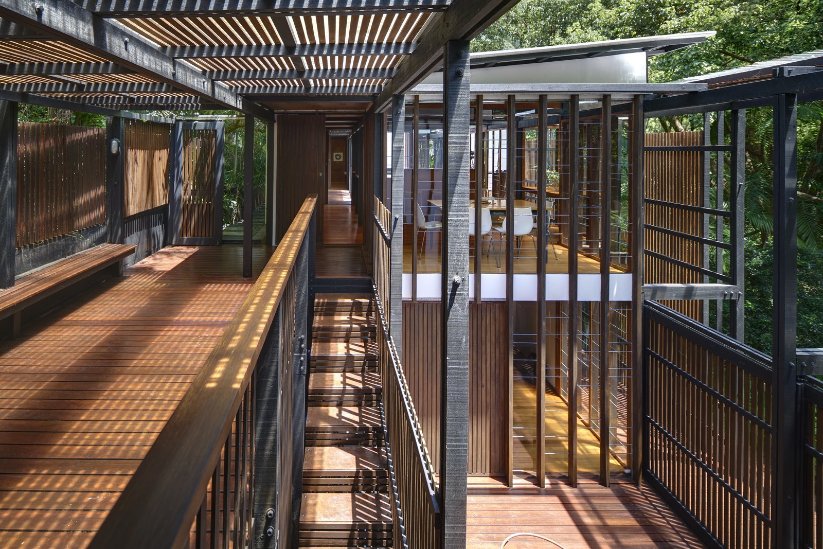 Comprised of linked pavilions, the home feels porous and well-connected with nature.