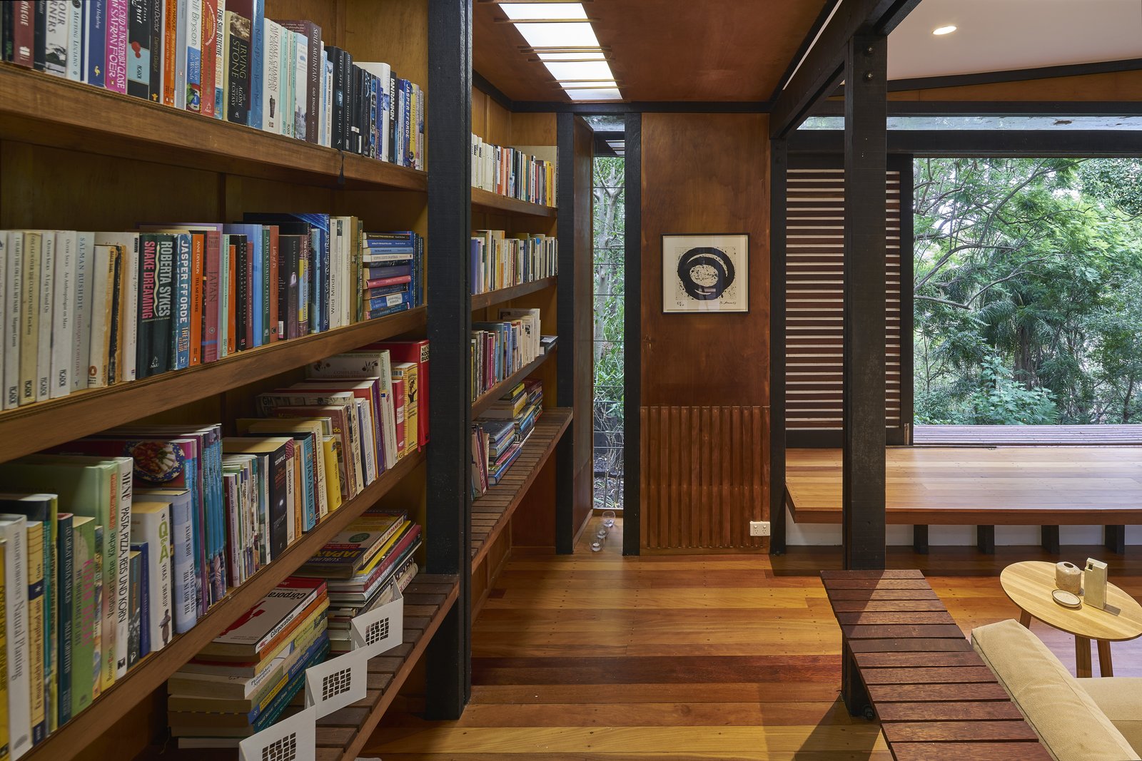 A daybed is set along the southern wall, next to two translucent, battened screens, that when opened, present beautiful views of the Brisbane river.
