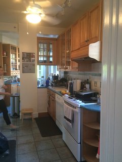 They replaced the wall between the dining room and the kitchen with a recessed beam to create a more open floor plan. 