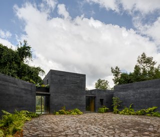 Large, floor-to-ceiling windows face the courtyard in most of the rooms.