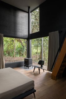 In one of these volumes is a children’s bedroom, with a master bedroom located above it. 