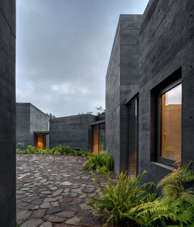 "As the patio closes itself to the surroundings, it also anticipates what is behind each enclosed volume, making each area a surprise," says Rodríguez.
