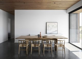 The house has floors of burnished concrete, providing thermal mass in the cooler months. The cement retains heat from the sun during the day and then slowly releases it back into the atmosphere to warm the interiors in the evening. 

