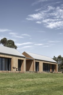 The 3,767-square-foot residence is comprised of two rural-style pavilions that are connected and clad in Blackbutt eucalyptus timber.

