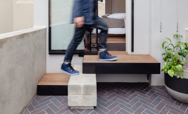 The XXX square-foot terrace is just one room wide at the front with a compact courtyard at the rear.
