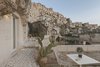 Modern home with Outdoor, Small Patio, Porch, Deck, Stone Patio, Porch, Deck, and Front Yard. The limestone rock is known locally as “tufo” of tuff. Photo 3 of La Dimora Di Matello
