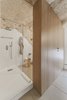 The result of Manca Studio’s precise and careful restoration is a space that balances lightness and modernity with the gravitas of ancient history. Photo 15 of La Dimora Di Matello modern home