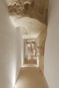 Modern home with Hallway and Terrazzo Floor. The single-level hotel and spa is spread across 3,229-square-feet, and includes a reception hall, a spa, and four bedrooms that all have access to an outdoor terrace. Photo 8 of La Dimora Di Matello