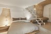 Modern home with Bedroom, Night Stands, Bed, Pendant Lighting, and Terrazzo Floor. The hotel was conceived as a box that contains layers of the past and expressed the roots of its unique heritage site. Photo 12 of La Dimora Di Matello