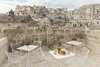 Modern home with Outdoor, Small Patio, Porch, Deck, Stone Patio, Porch, Deck, Front Yard, and Horizontal Fences, Wall. In some parts of the ancient city, the streets run above these subterranean cave homes. Photo 4 of La Dimora Di Matello